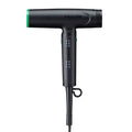 Black hair dryer with green accents on a white background